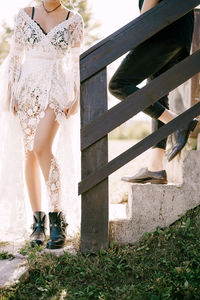 Low section of woman standing on ground