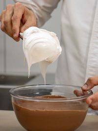 Midsection of man holding drink