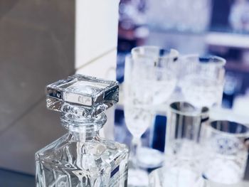 Close-up of glass bottles on table