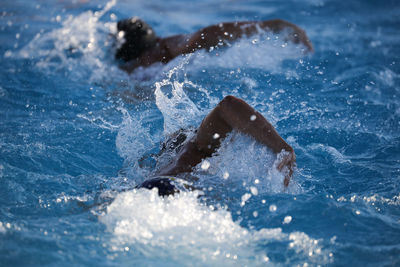 People swimming in sea