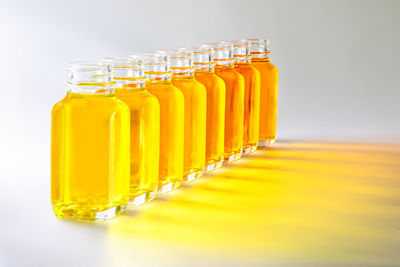 Close-up of yellow glass jar on table