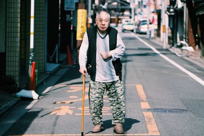 Portrait of young woman standing in park