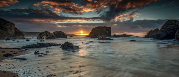 Scenic view of sea against sky during sunset