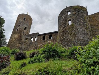 Low angle view of old building against sky