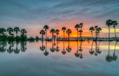 Scenic view of lake against sky during sunset