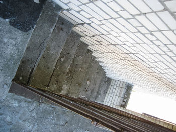 Low angle view of railroad tracks in city