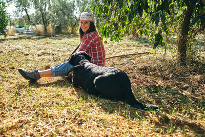 Woman sitting on field