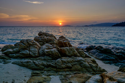 Scenic view of sea against sky during sunset