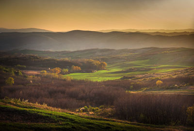 Scenic view of landscape against sky during sunset