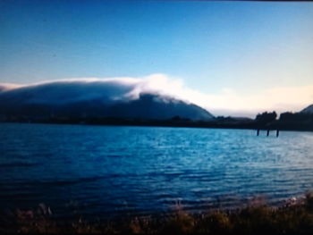 Scenic view of lake against sky during sunset