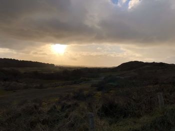 Scenic view of landscape against sky during sunset