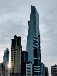 Low angle view of buildings against sky in city