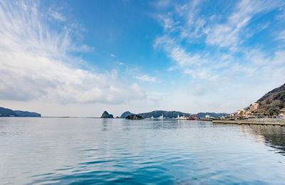 Scenic view of sea against blue sky