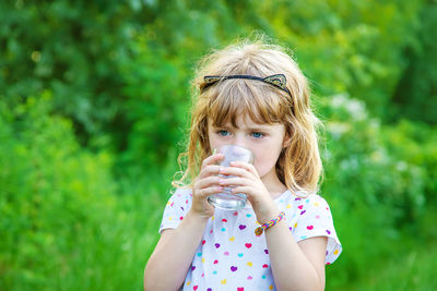 Young woman drinking water