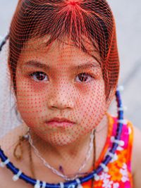 Close-up portrait of girl wearing net