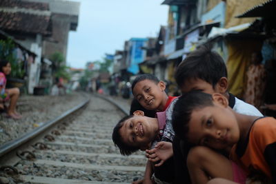 Portrait of people on railroad tracks