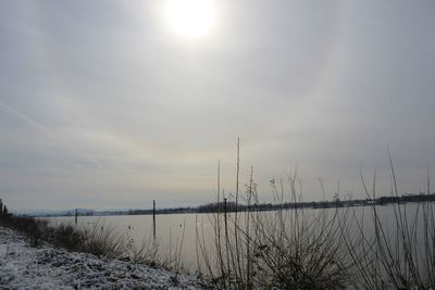 Scenic view of land against sky during winter
