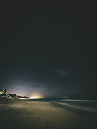 Scenic view of sea against sky at night