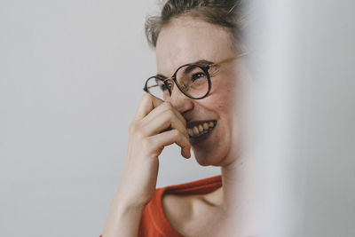 Portrait of happy young woman with glasses