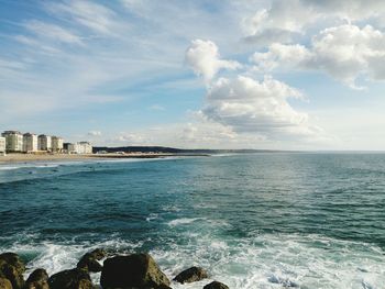 Scenic view of sea against cloudy sky