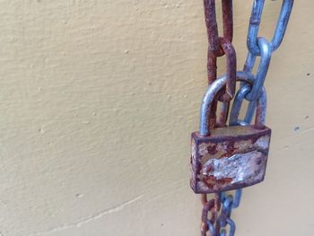 Close-up of padlocks on metal chain