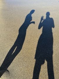 Shadow of man on silhouette people
