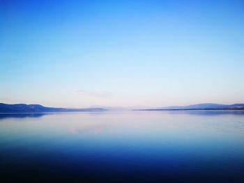 Scenic view of calm sea against sky