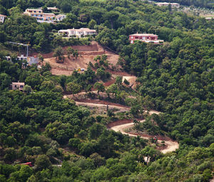 High angle view of road construction amidst trees