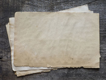 High angle view of old papers on wooden table