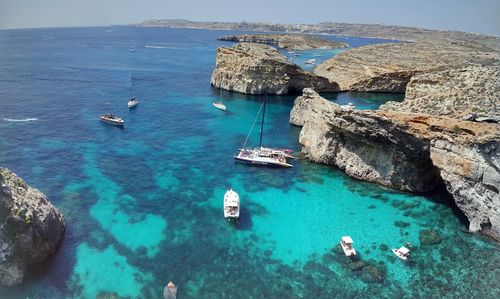 High angle view of sailboats in sea