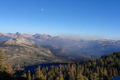 Scenic view of mountains against clear blue sky