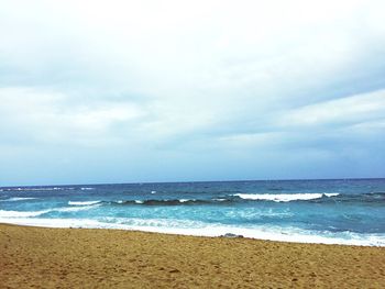 Scenic view of beach against sky