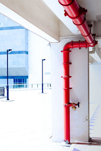Red pipe at corridor of building