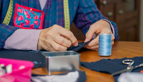 Midsection of man working at table