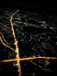 Aerial view of illuminated river at night