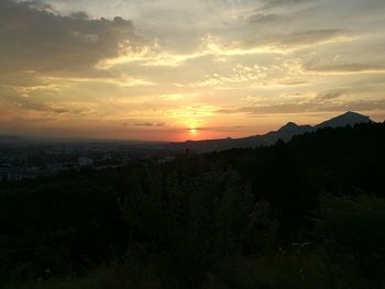 Scenic view of silhouette landscape against sky during sunset