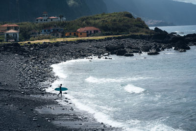 High angle view of people swimming in sea