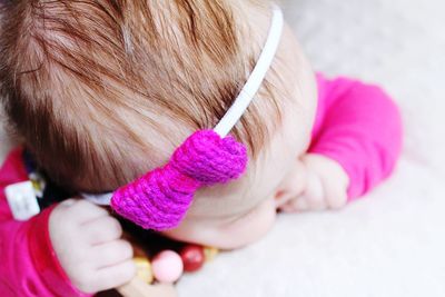 Close-up of baby girl wearing pink headband