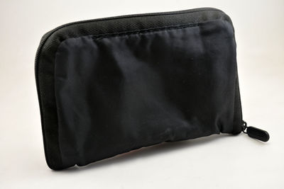 High angle view of leather on table against white background