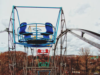Low angle view of ferris wheel against sky