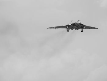 Low angle view of airplane flying in sky