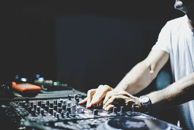 Midsection of musician playing music in nightclub