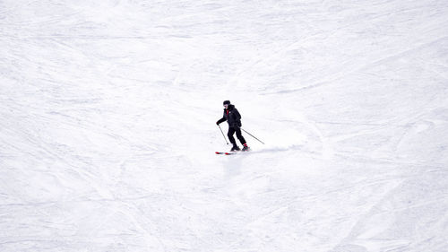 Full length of man skiing on snowcapped mountain