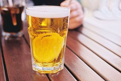 Close-up of beer glass on table