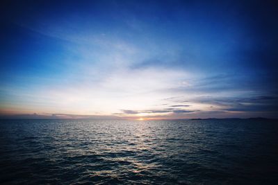 View of calm sea against cloudy sky