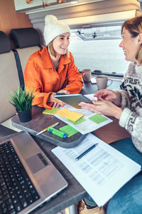 Businesswomen working while traveling