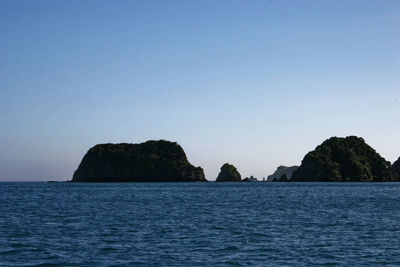 Scenic view of sea against clear blue sky