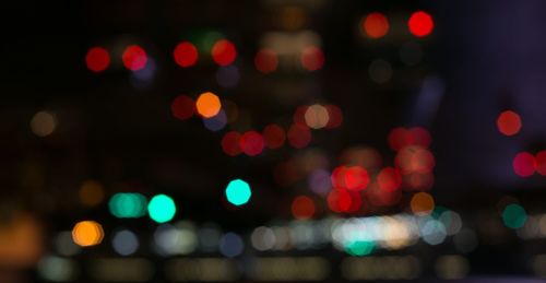 Defocused image of illuminated lights at night