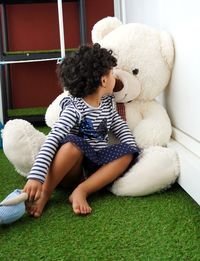 Cute baby girl with toy at home