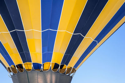 Low angle view of hot air balloon against blue sky